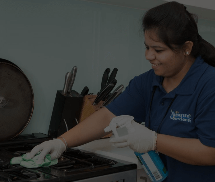 Regular domestic cleaning Home cleaners working in the kitchen
